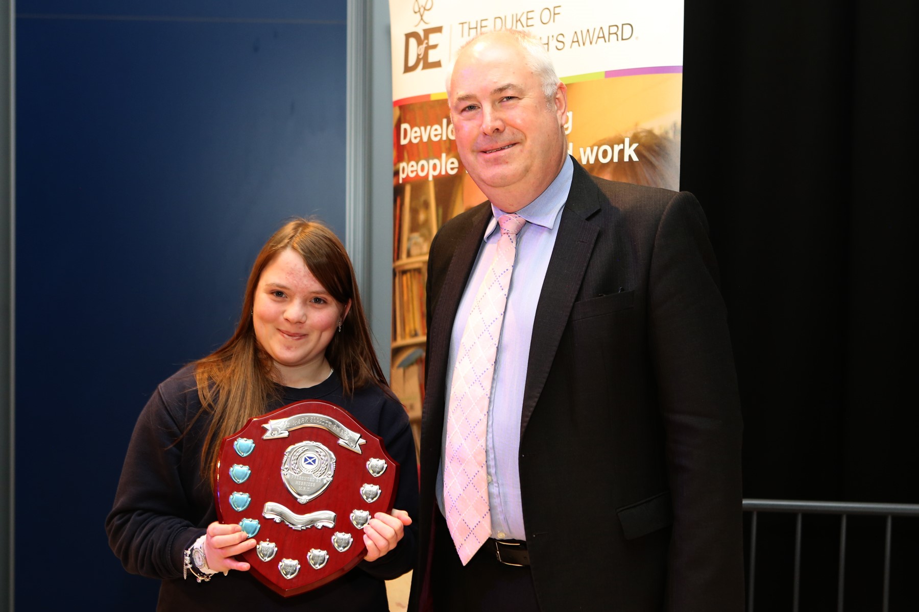 Malcolm Burr presenting the award to Roseanne Smith-Macinnes