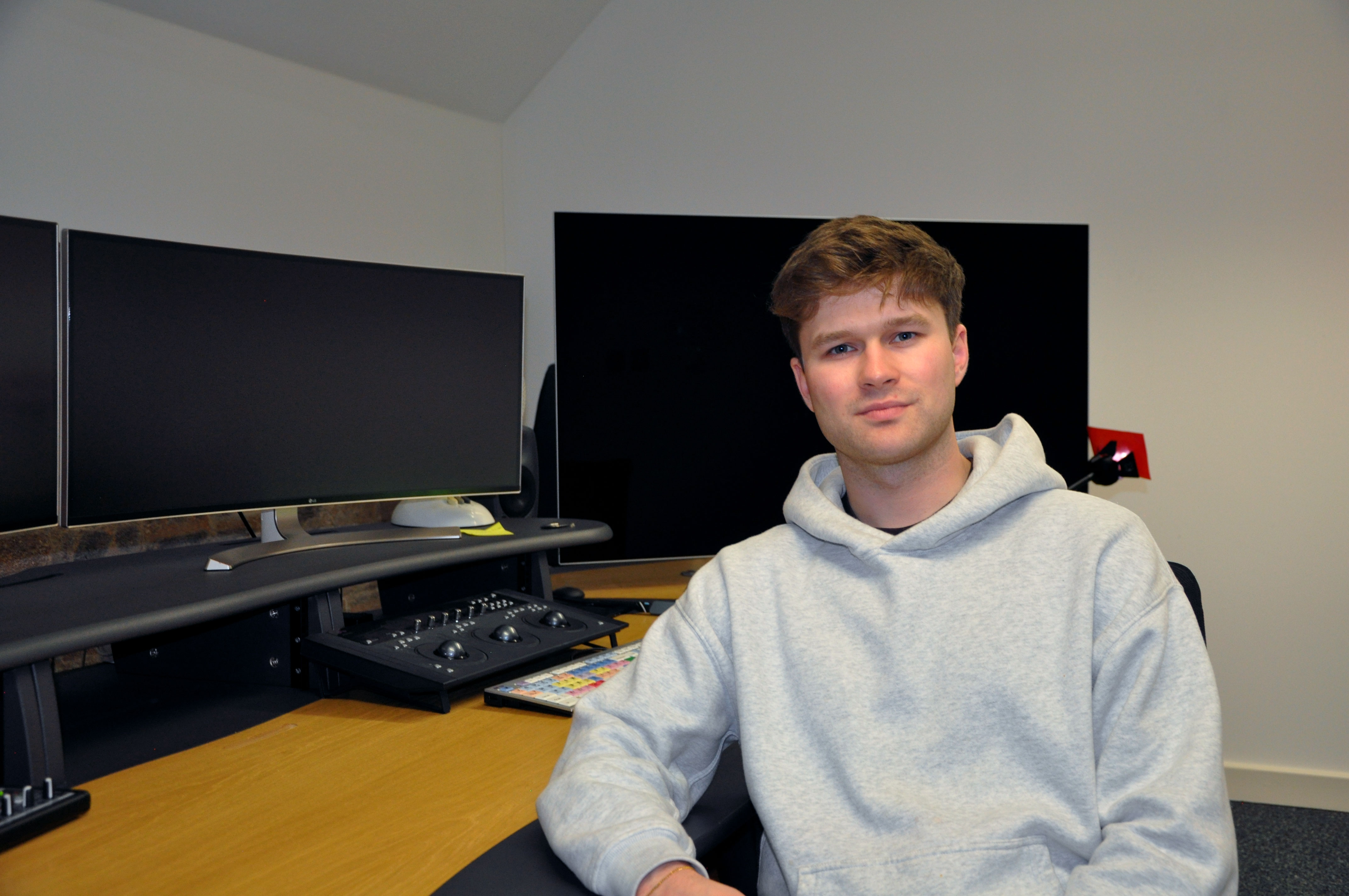 Morgan sat at his desk looking towards the camera