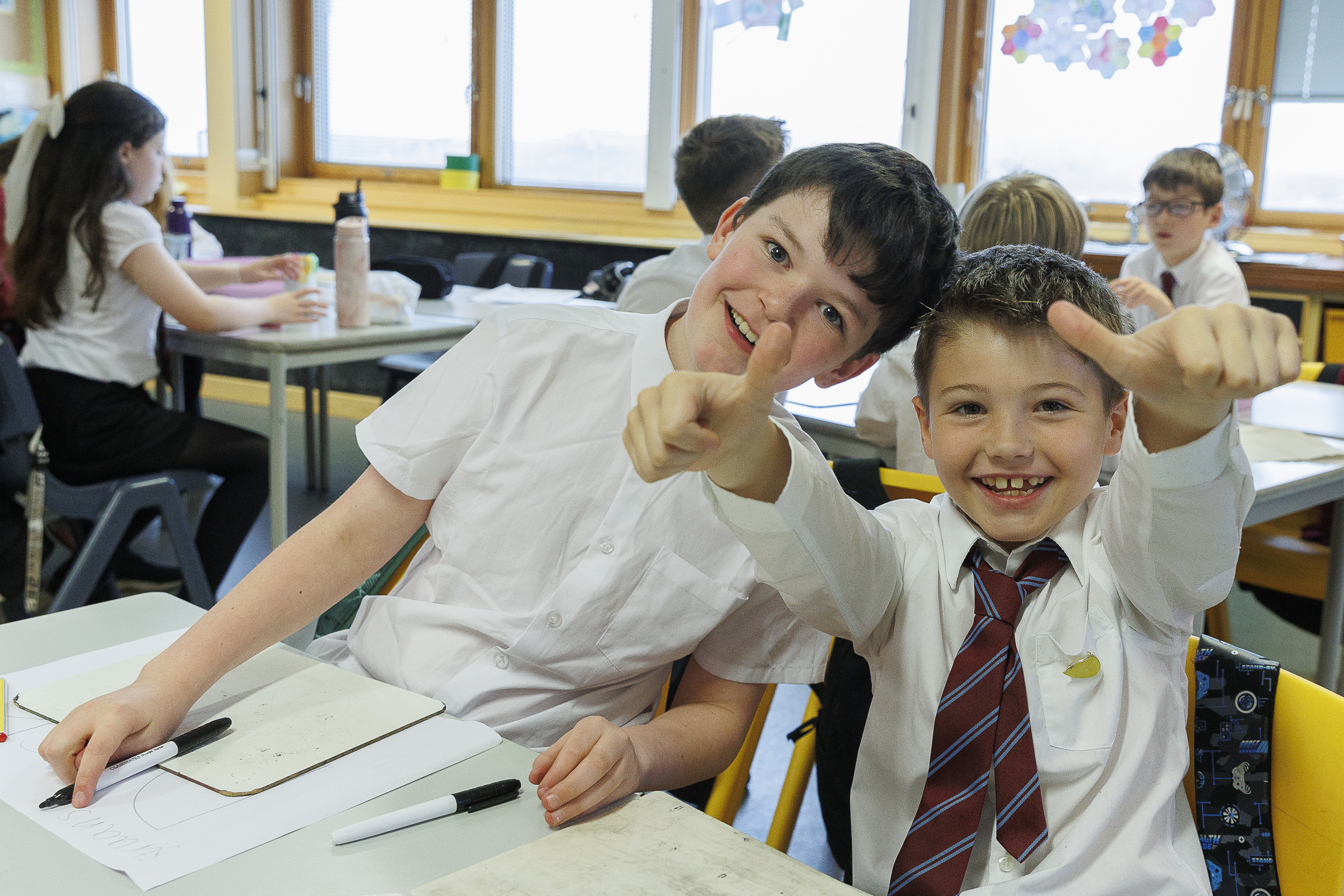 Two Sgoil nan Loch GME Pupils smiling at the camera