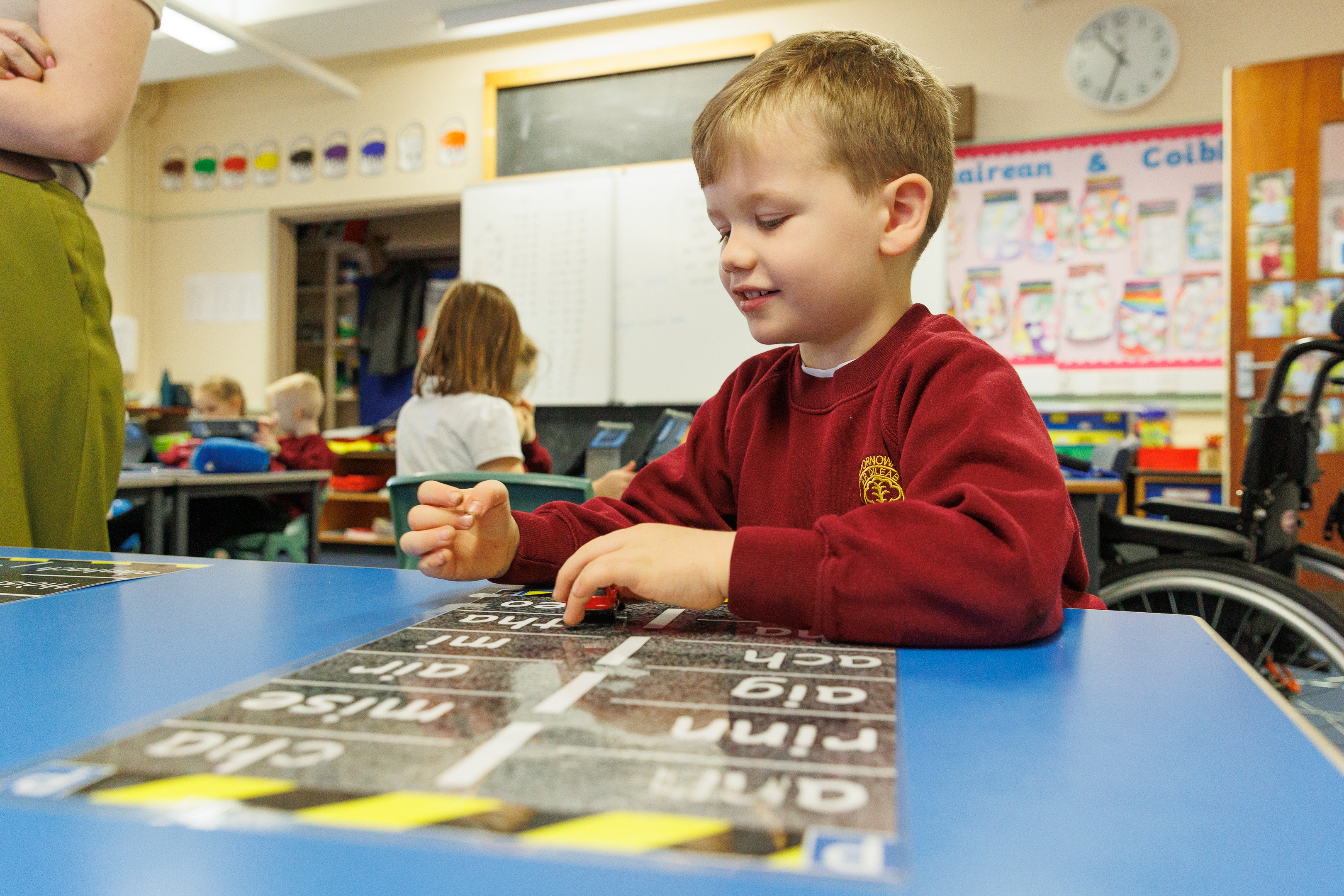 A Sgoil nan Loch GME Pupil at their desk